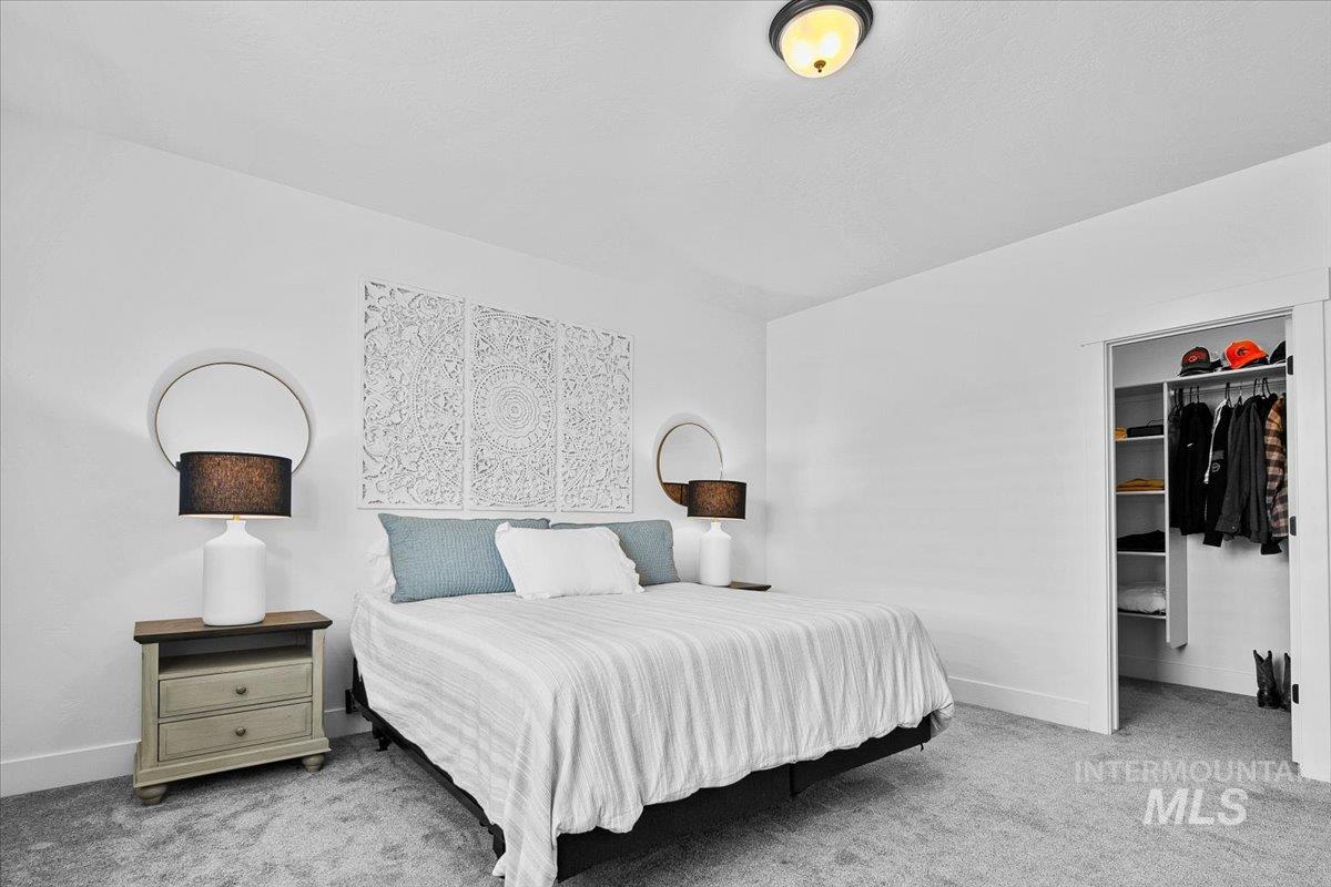 2085 North Concha Court Middleton, ID 83644 - Photo 18 of 37 Bedroom with light colored carpet and a spacious closet