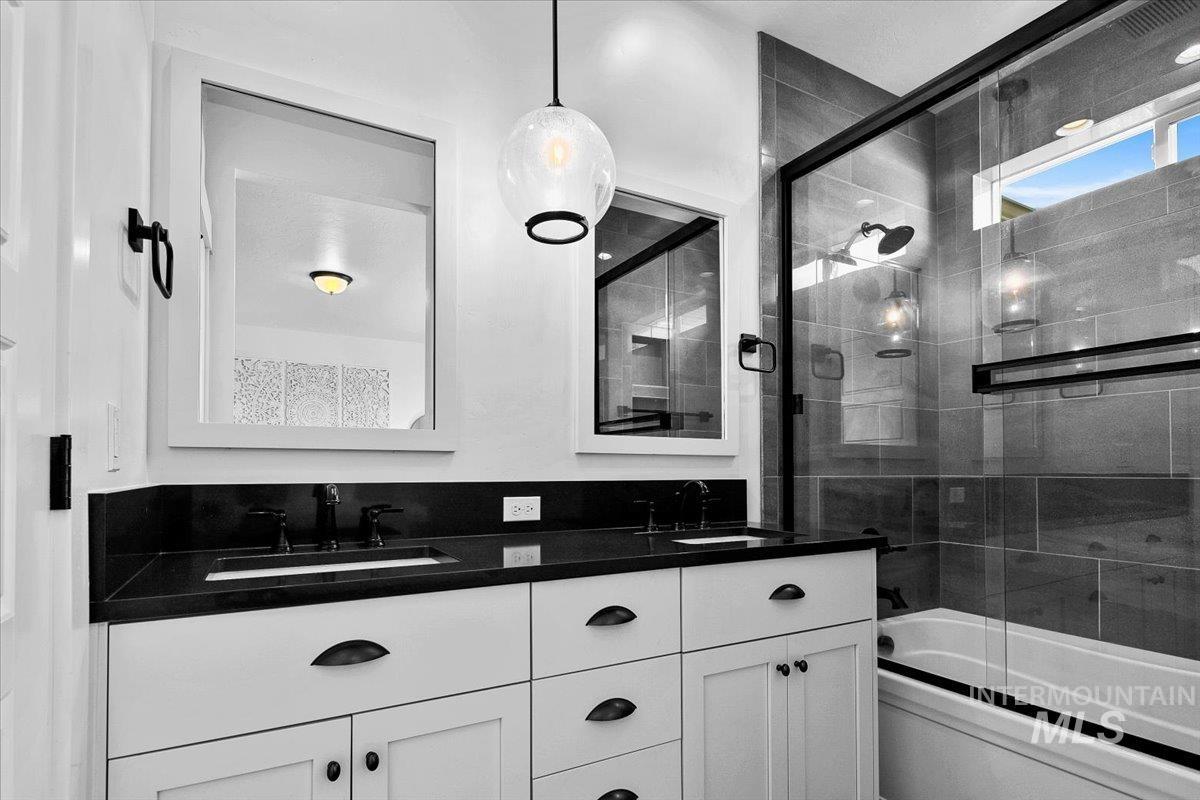 2085 North Concha Court Middleton, ID 83644 - Photo 20 of 37 Bathroom with double vanity and combined bath / shower with glass door