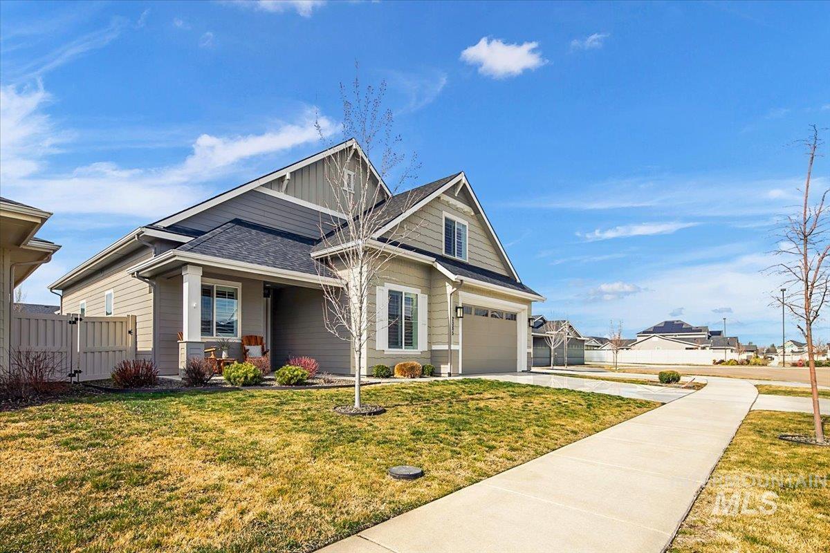 2085 North Concha Court Middleton, ID 83644 - Photo 2 of 37 Craftsman house featuring a gate, concrete driveway, roof with shingles, and covered porch