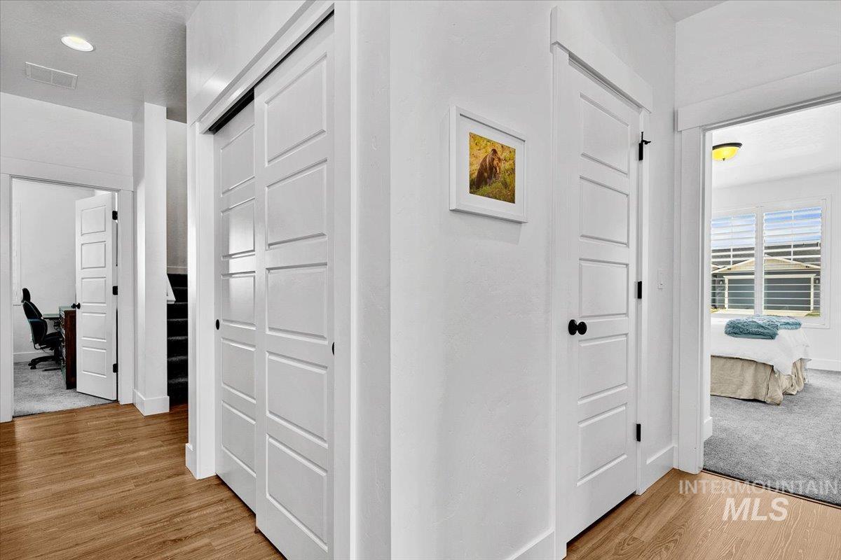 2085 North Concha Court Middleton, ID 83644 - Photo 22 of 37 Hallway featuring an office area and light wood-style flooring