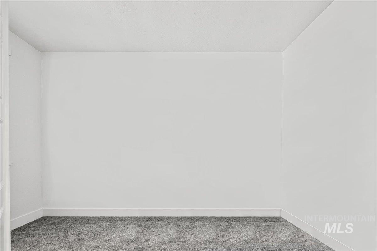 2085 North Concha Court Middleton, ID 83644 - Photo 29 of 37 Unfurnished room with baseboards and light carpet