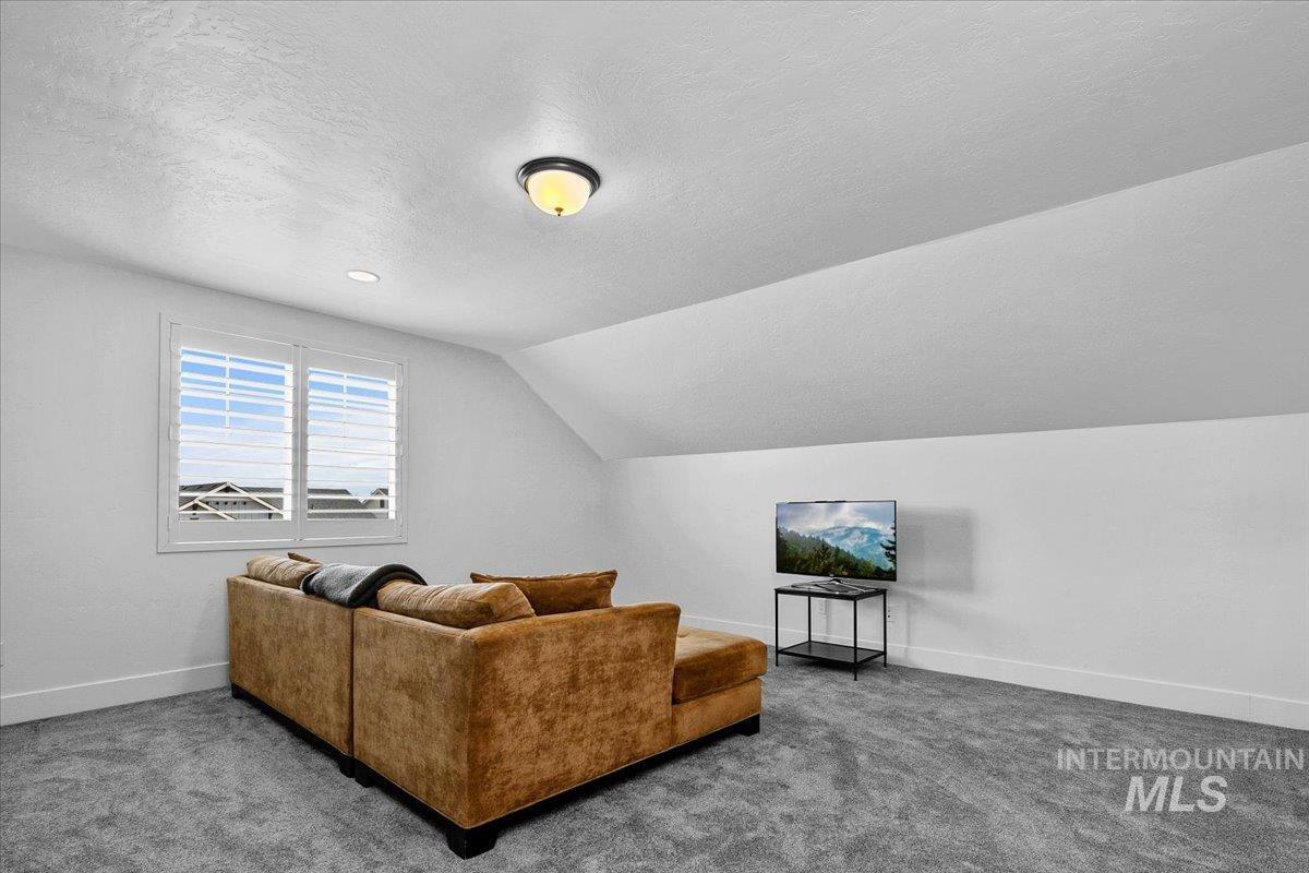 2085 North Concha Court Middleton, ID 83644 - Photo 30 of 37 Carpeted living room featuring baseboards