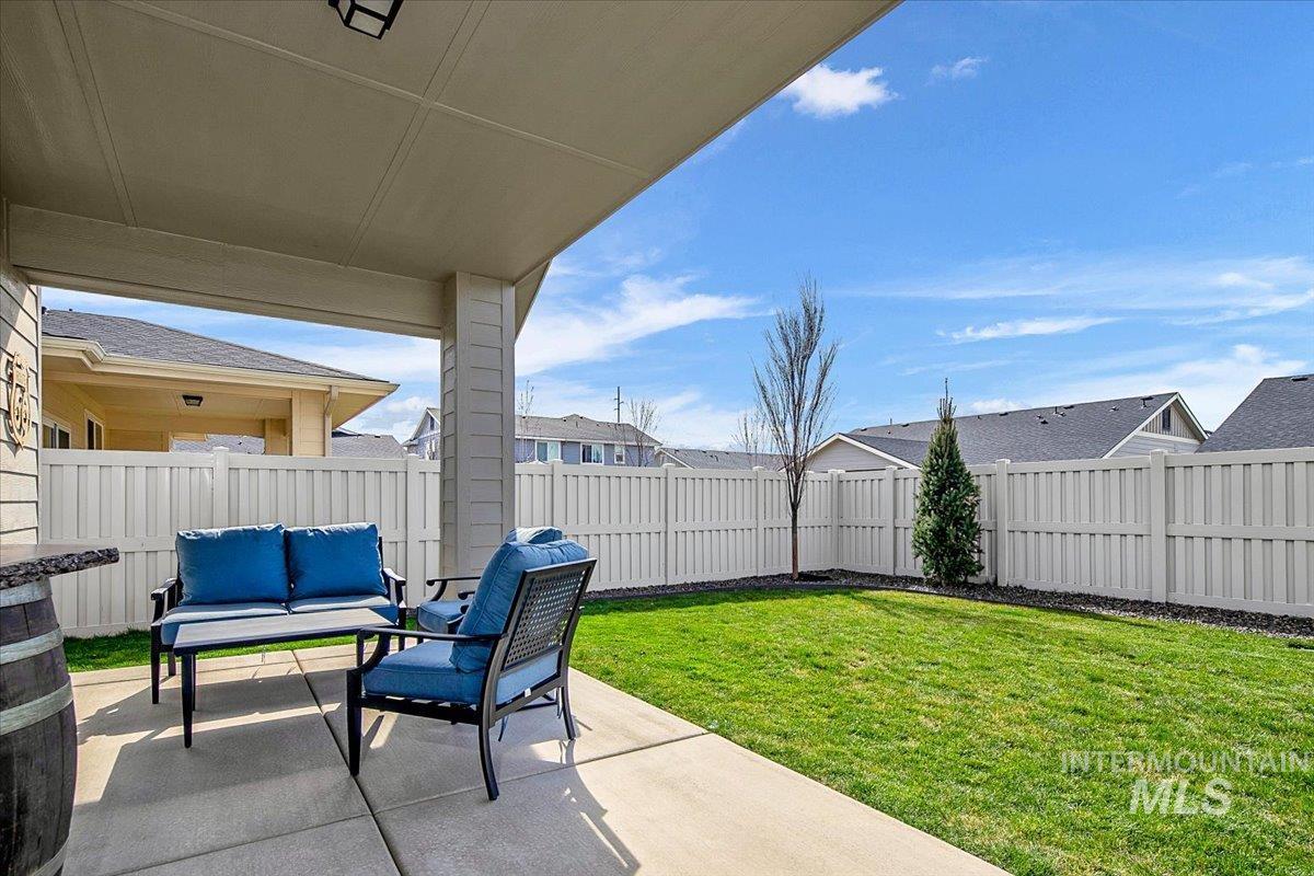 2085 North Concha Court Middleton, ID 83644 - Photo 37 of 37 Fenced backyard with a patio and an outdoor living space