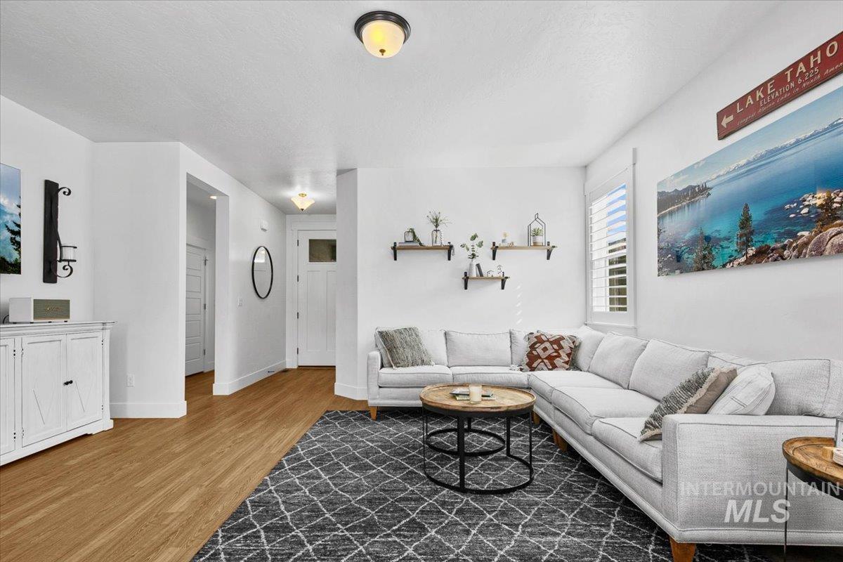2085 North Concha Court Middleton, ID 83644 - Photo 7 of 37 Living room with light wood finished floors and baseboards