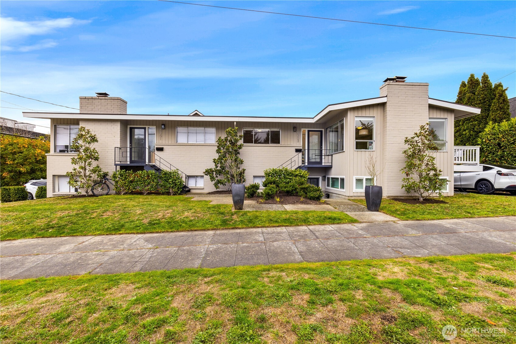 6301 22nd Avenue Northwest Seattle, WA 98107 - Photo 1 of 19 a view of a house with a yard and plants