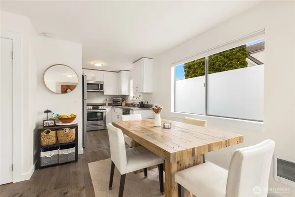 a kitchen with a table and chairs in it