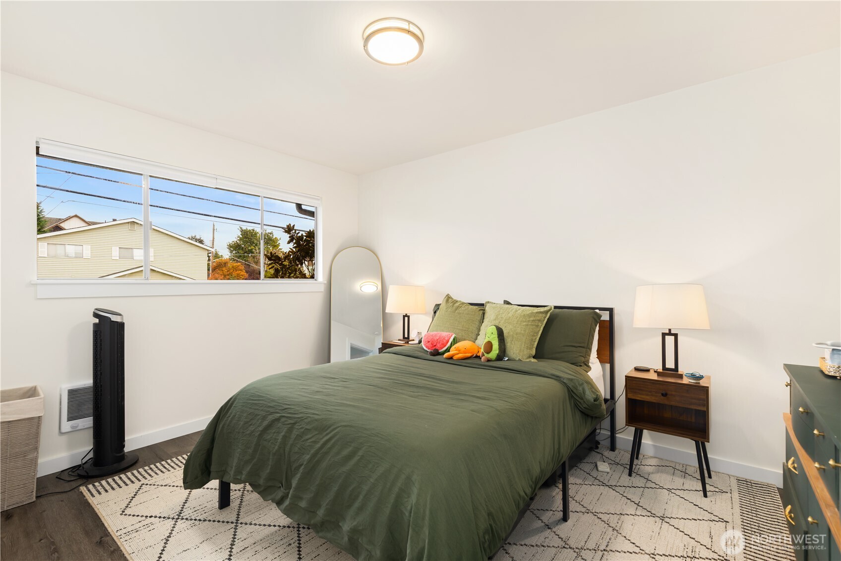 6301 22nd Avenue Northwest Seattle, WA 98107 - Photo 16 of 19 a bed sitting in a bedroom next to a lamp