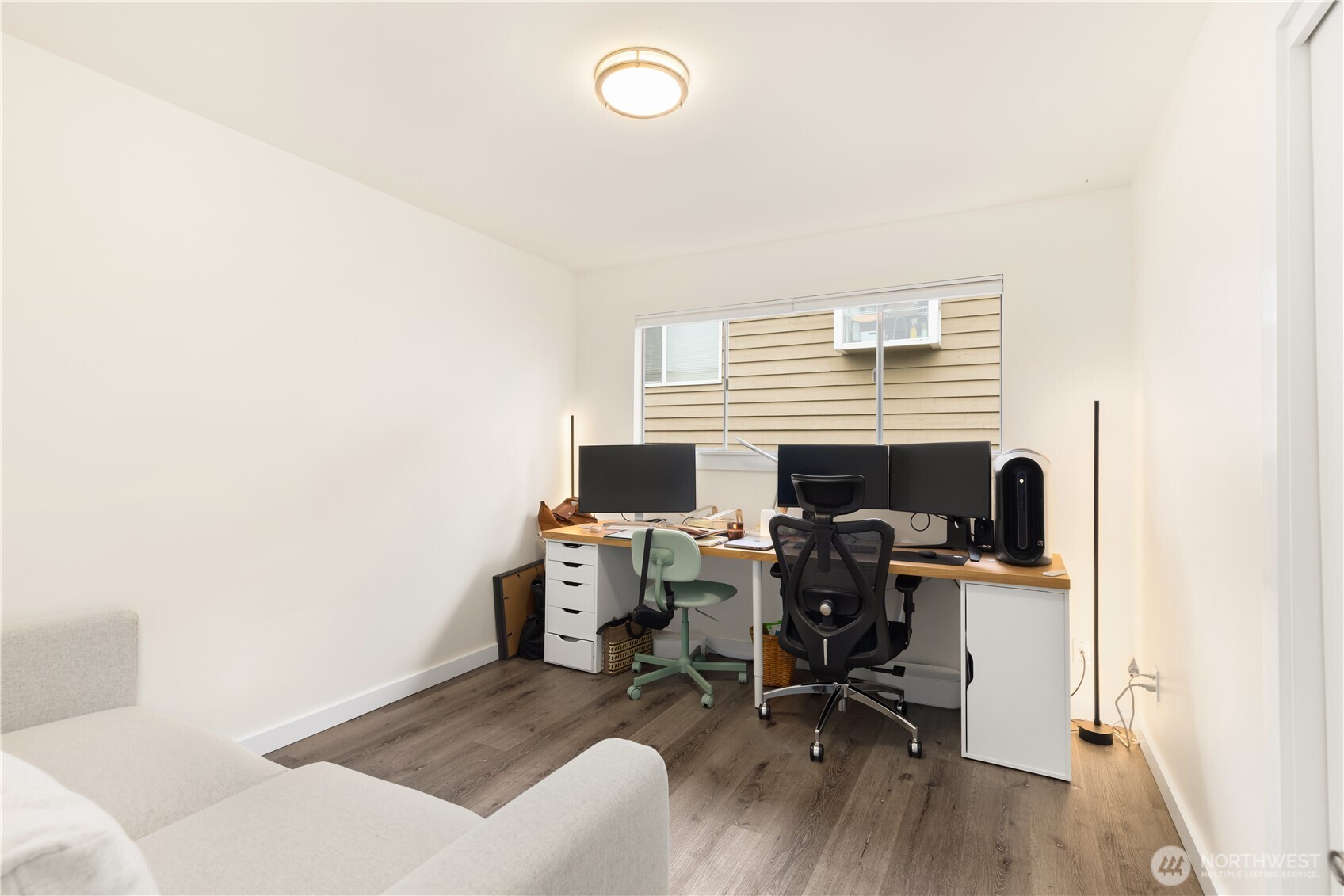 6301 22nd Avenue Northwest Seattle, WA 98107 - Photo 17 of 19 a view of a workspace with furniture and a window
