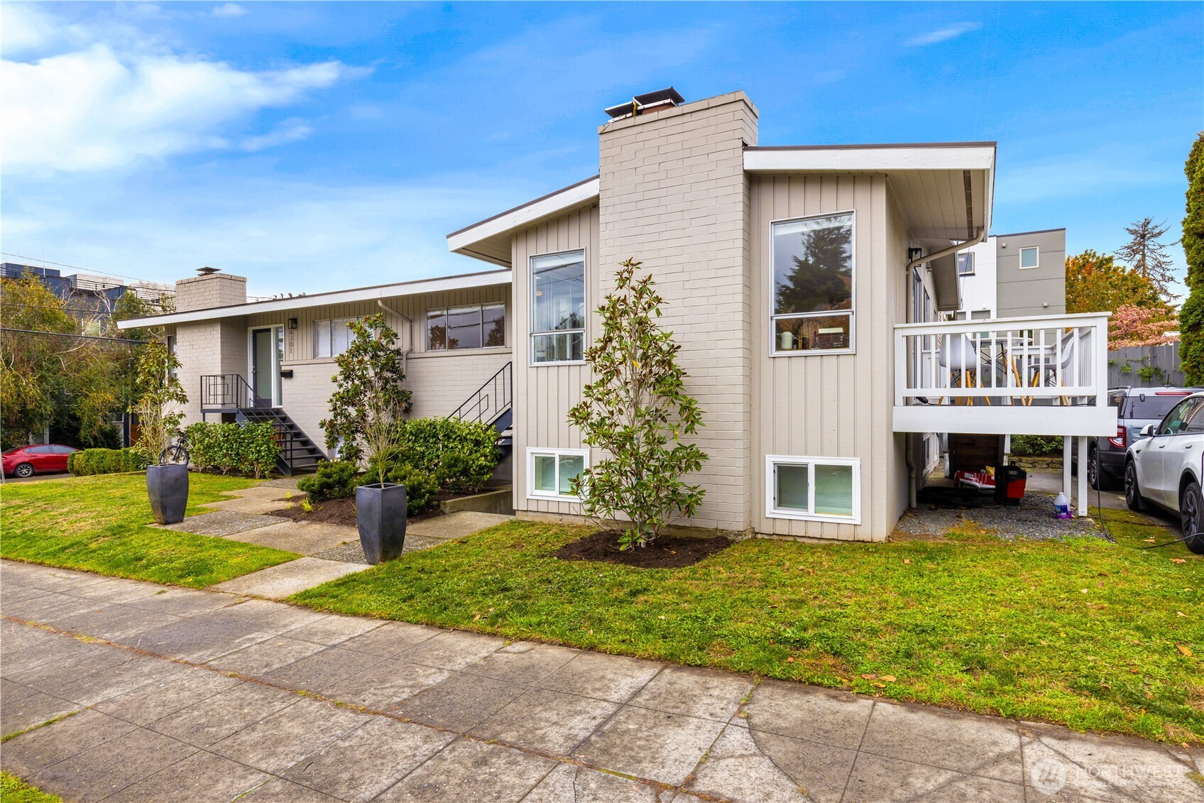 6301 22nd Avenue Northwest Seattle, WA 98107 - Photo 2 of 19 a front view of house with yard and green space