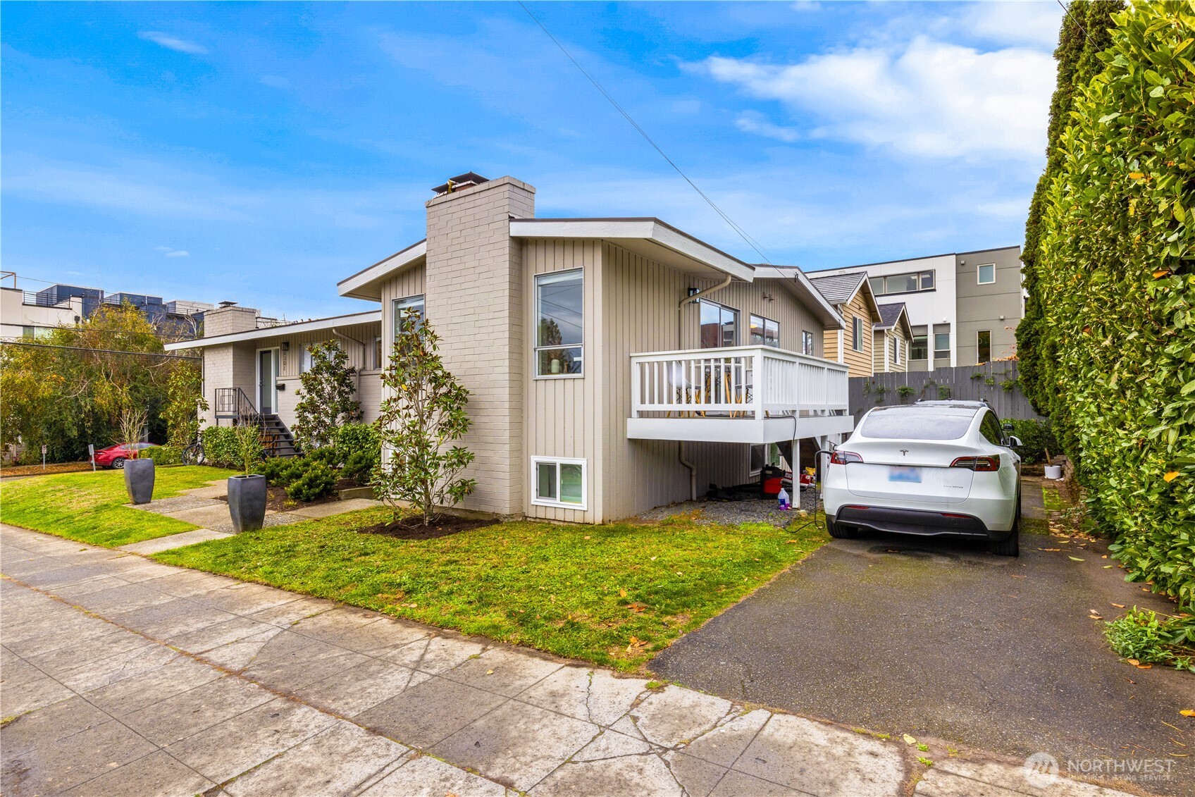 6301 22nd Avenue Northwest Seattle, WA 98107 - Photo 3 of 19 a front view of a house with a garden and yard