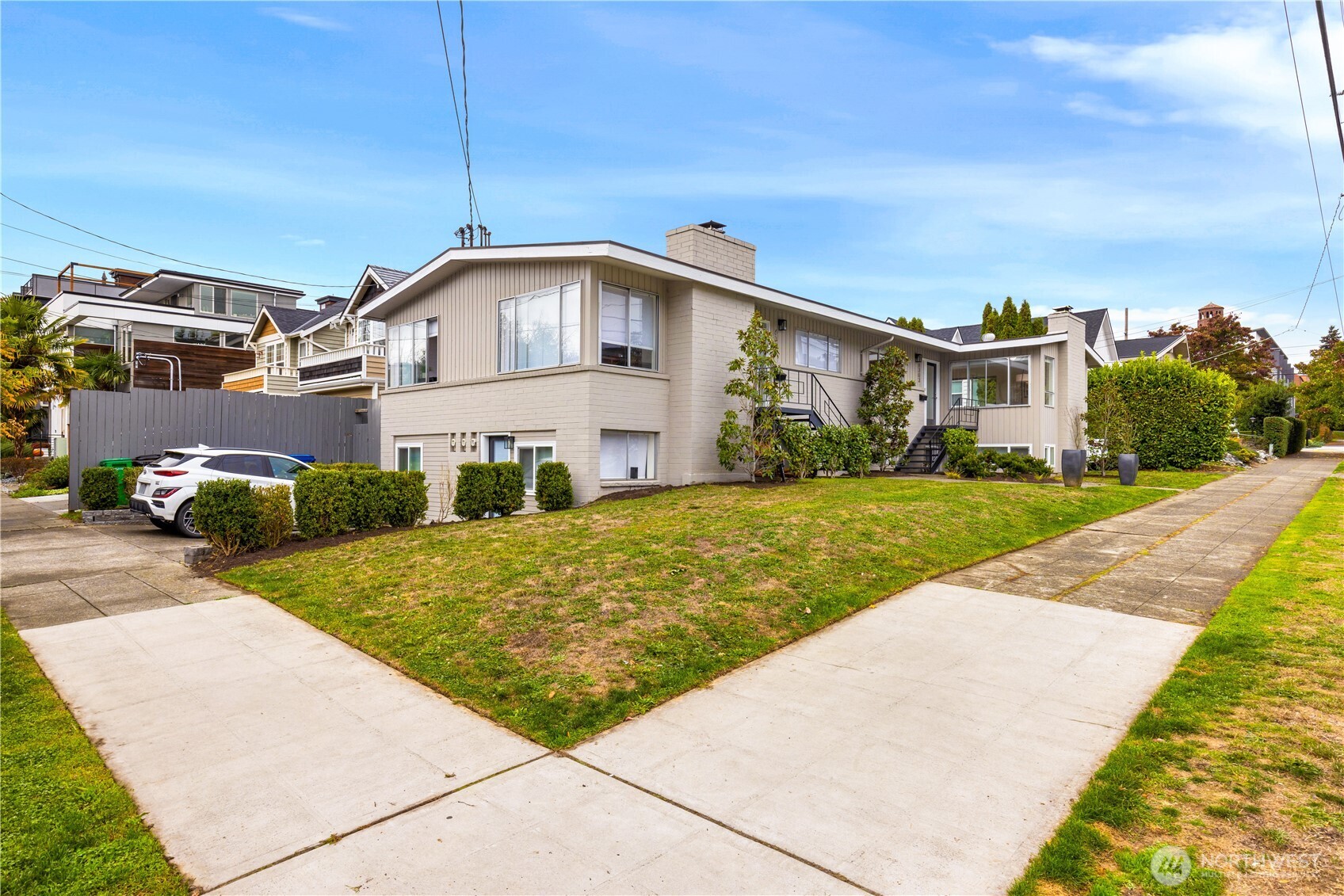 6301 22nd Avenue Northwest Seattle, WA 98107 - Photo 4 of 19 a front view of a house with a yard
