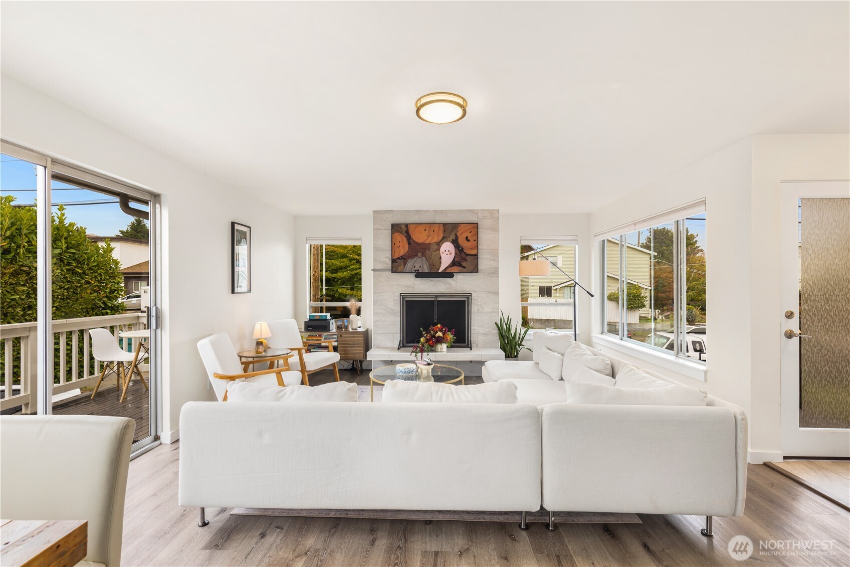 6301 22nd Avenue Northwest Seattle, WA 98107 - Photo 6 of 19 a living room with fireplace furniture and a large window