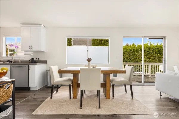 a view of a dining room with furniture window and wooden floor