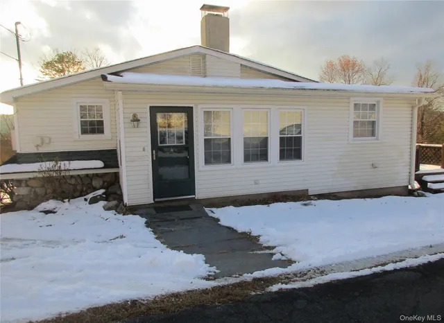 a front view of a house with yard