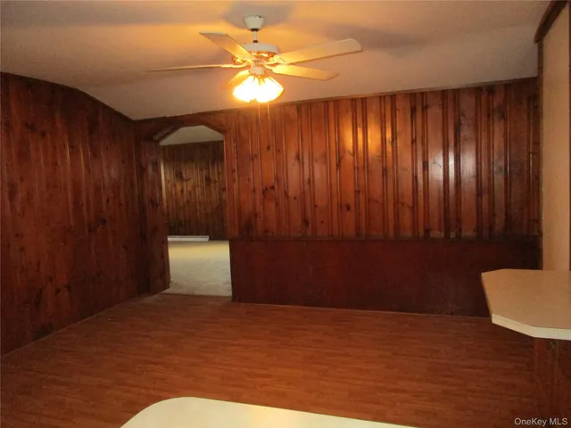 a view of a room with a hardwood