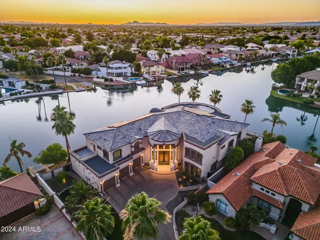 an aerial view of a house with a lake view