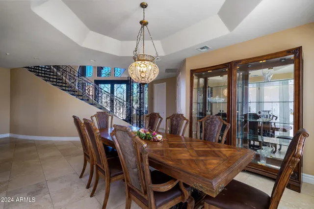 a large living room with a couch and a view of bathroom