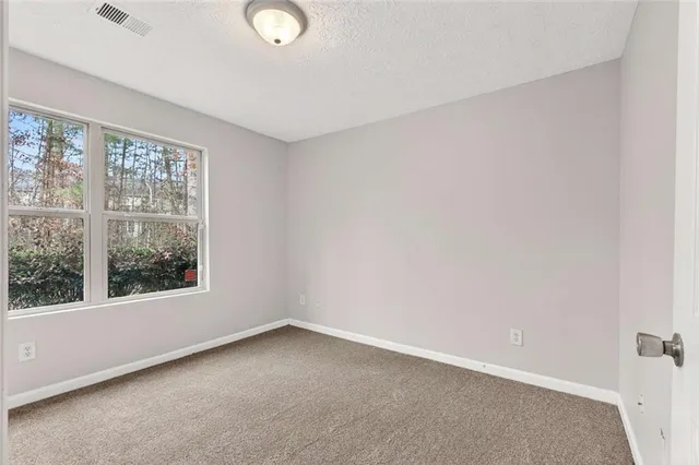 a bathroom with a sink toilet tub vanity and shower