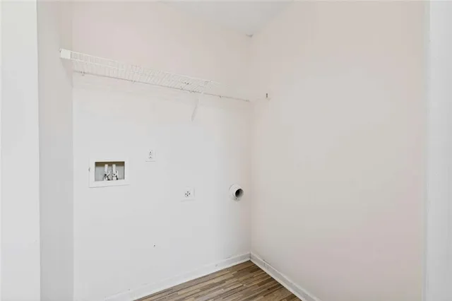 a view of hallway with wooden floor