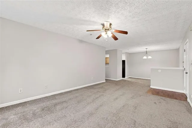 a kitchen with a refrigerator and a sink