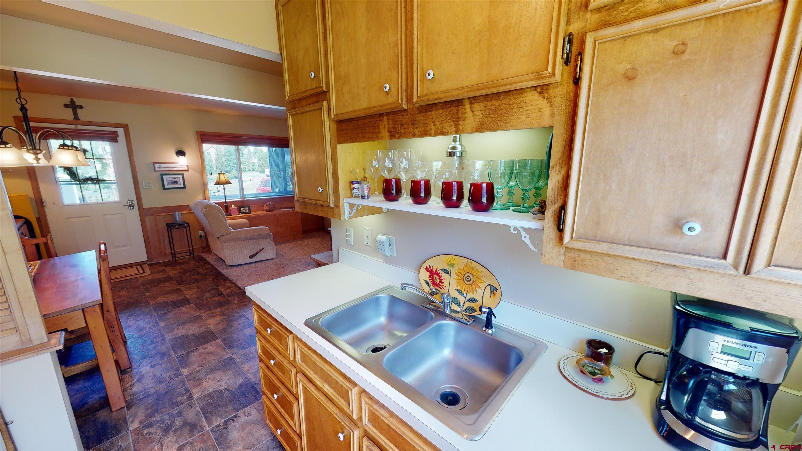 18 Crystal Road, Unit 2C Crested Butte, CO 81225 - Photo 12 of 23 a living room with furniture and a window