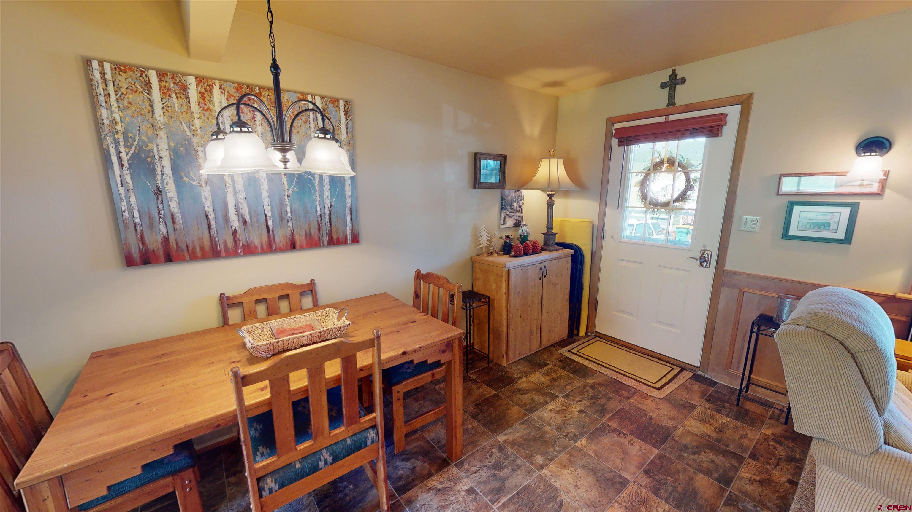 18 Crystal Road, Unit 2C Crested Butte, CO 81225 - Photo 4 of 23 a dining room with furniture and window