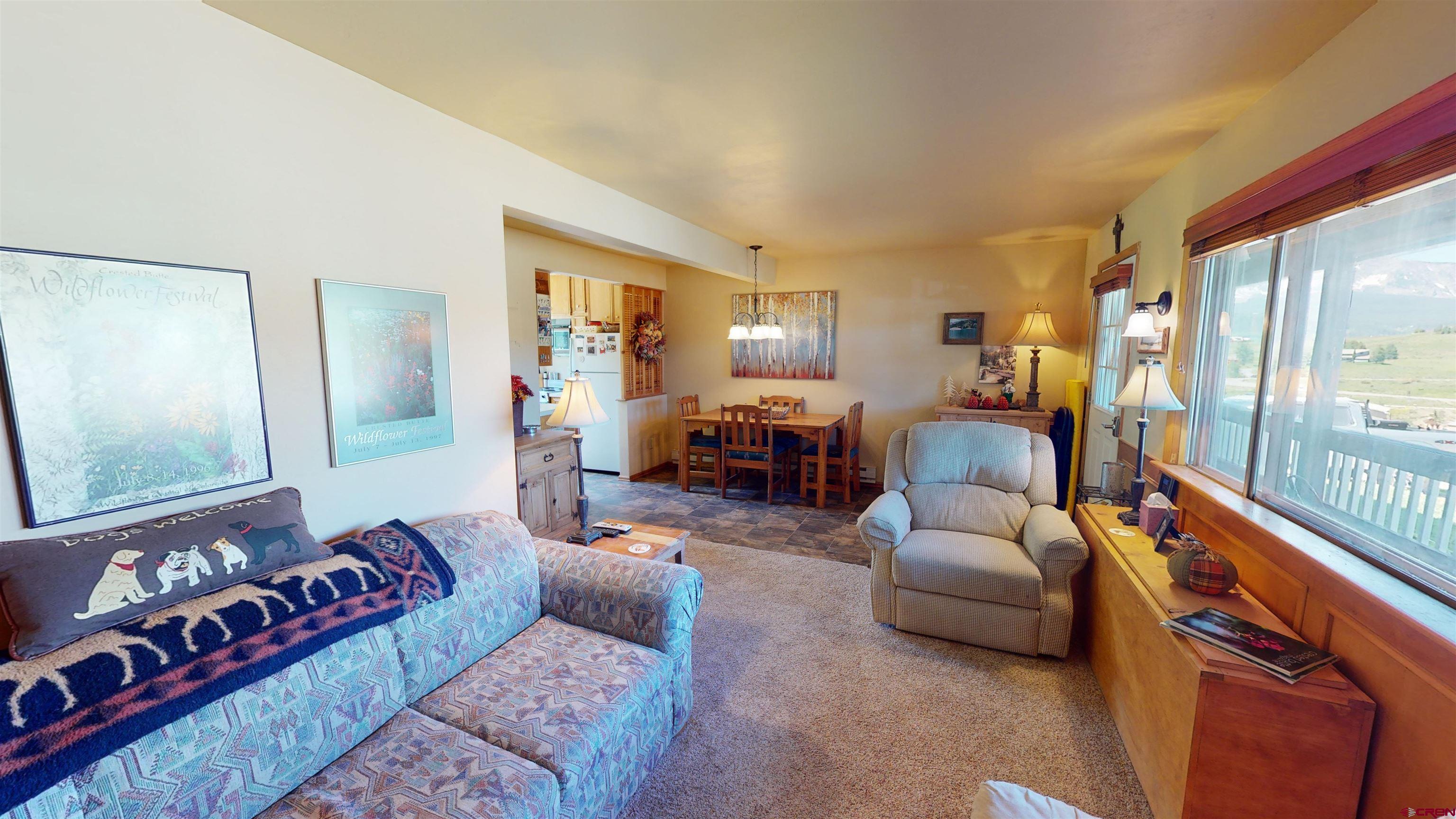 18 Crystal Road, Unit 2C Crested Butte, CO 81225 - Photo 9 of 23 a bedroom with furniture and a large window