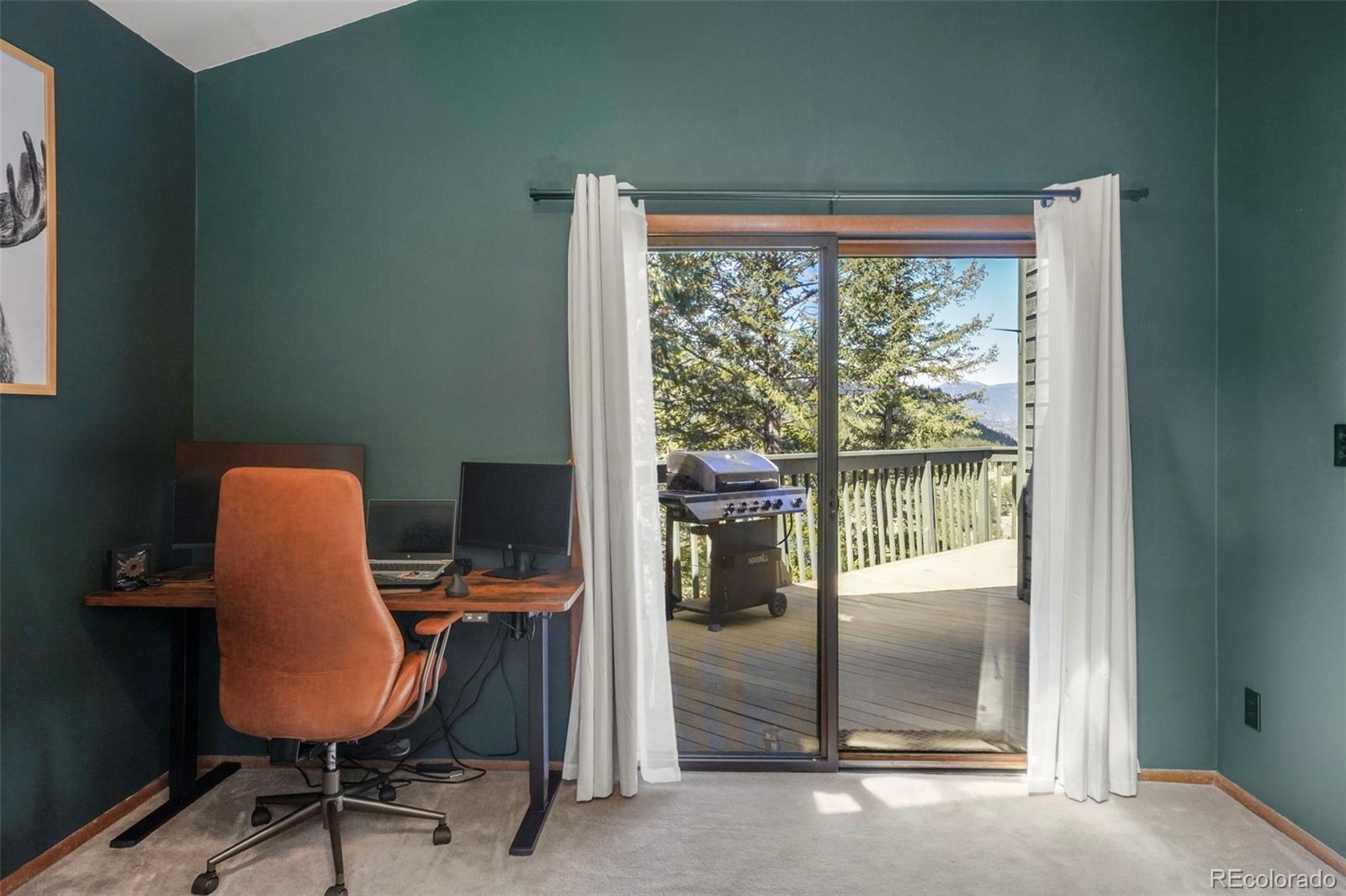 25756 Zugspitz Road Evergreen, CO 80439 - Photo 13 of 43 a workspace with furniture and a window