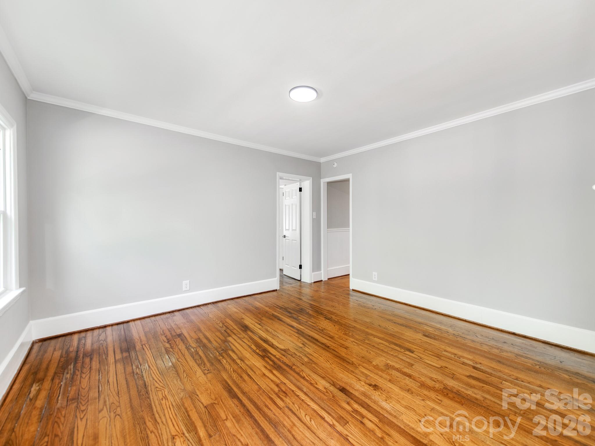 120 Sunset Drive Chester, SC 29706 - Photo 14 of 34 a view of an empty room with wooden floor and a window