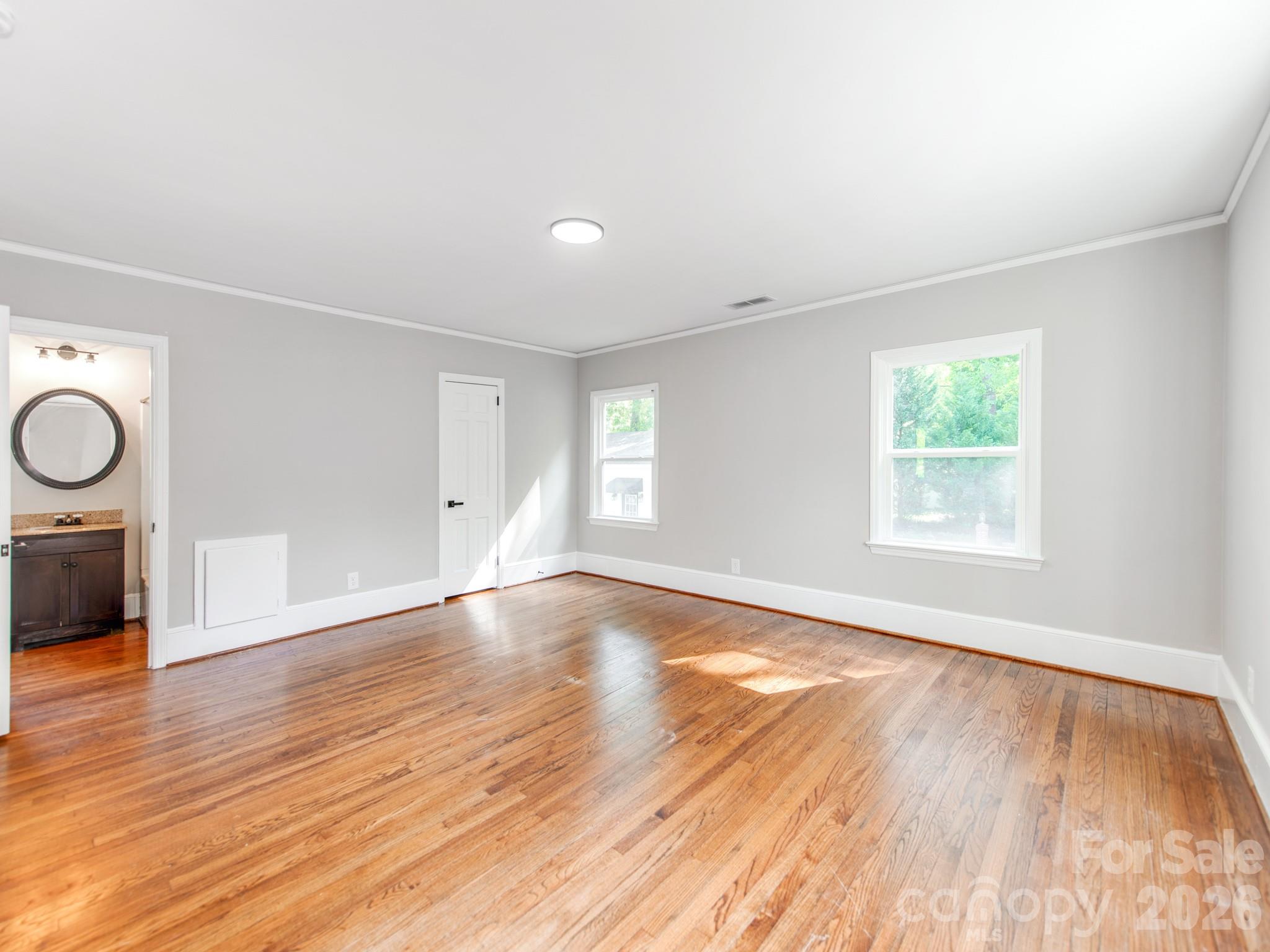 120 Sunset Drive Chester, SC 29706 - Photo 23 of 34 an empty room with wooden floor and windows