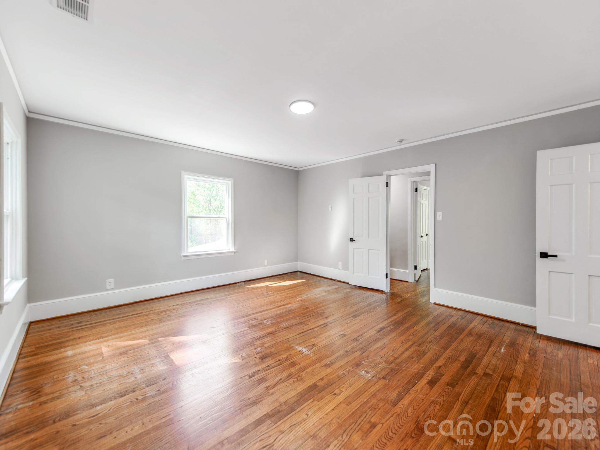 120 Sunset Drive Chester, SC 29706 - Photo 24 of 34 a view of an empty room with wooden floor and window