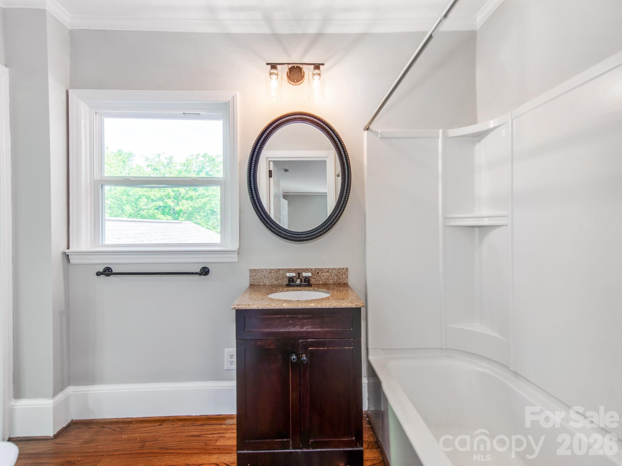 120 Sunset Drive Chester, SC 29706 - Photo 25 of 34 a bathroom with a sink a bathtub and a window