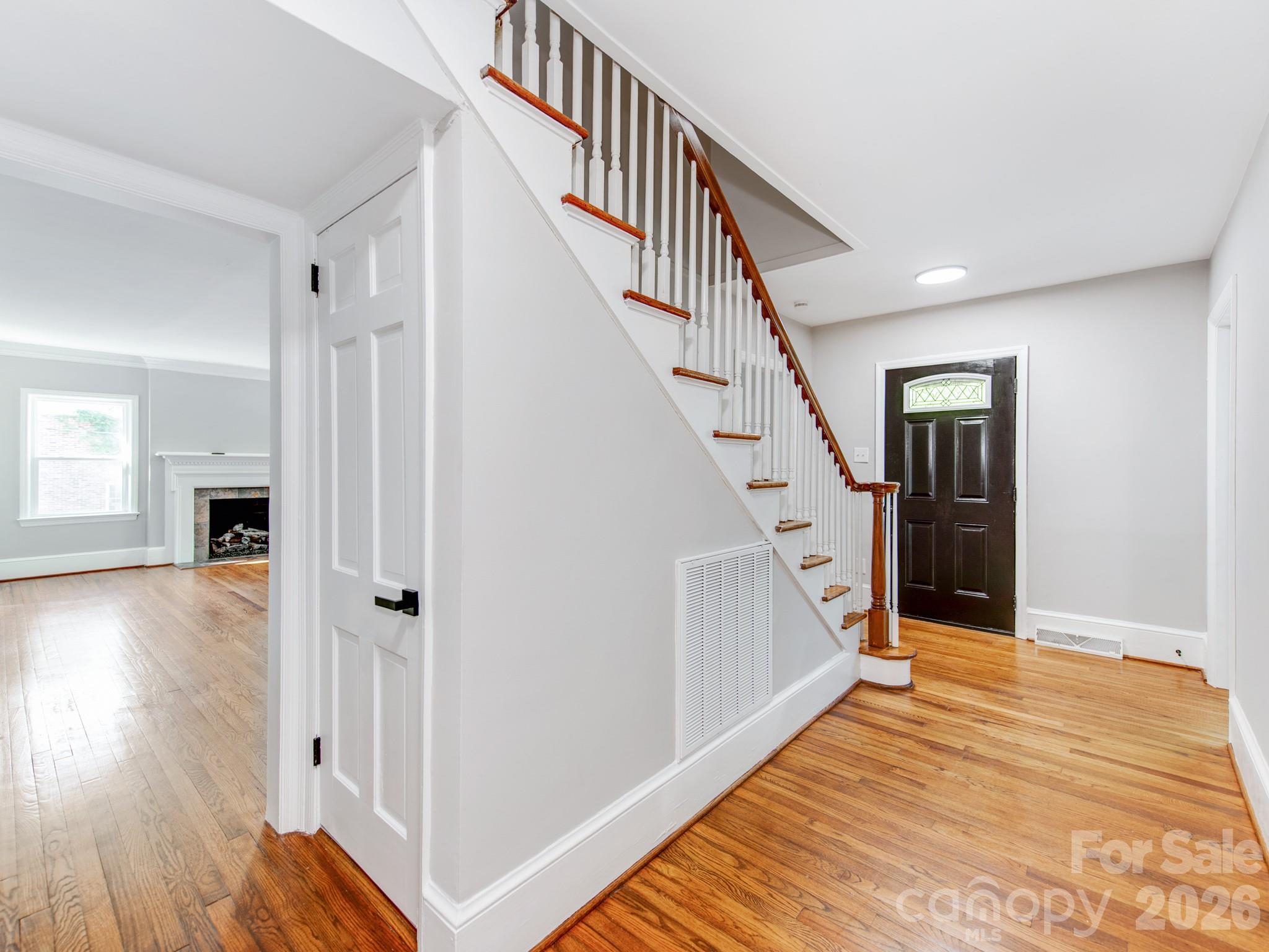 120 Sunset Drive Chester, SC 29706 - Photo 5 of 34 a view of a hallway with wooden floor and staircase