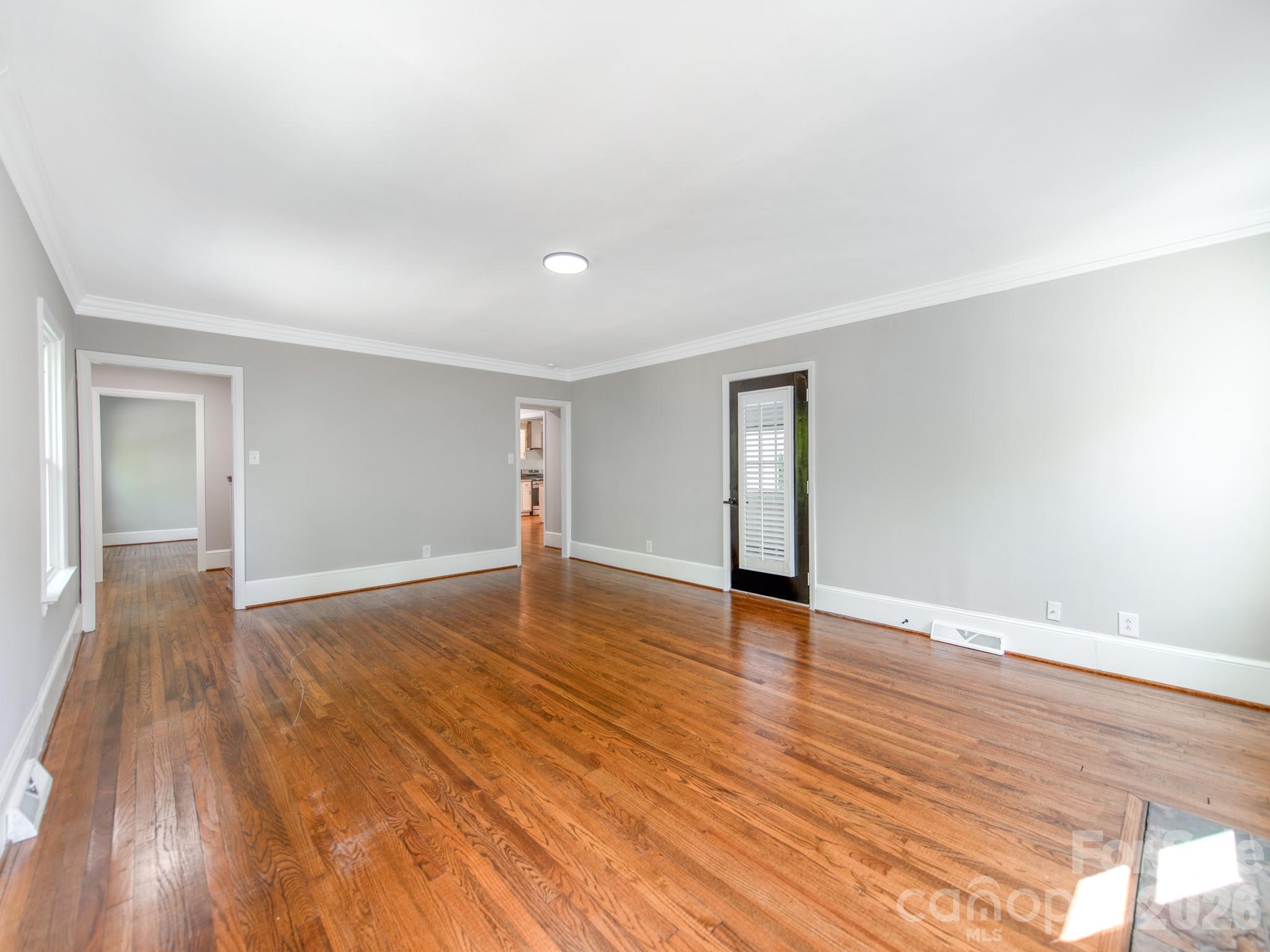 120 Sunset Drive Chester, SC 29706 - Photo 8 of 34 a view of an empty room with wooden floor and closet