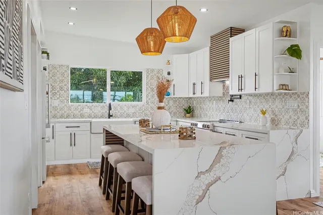 a kitchen with a sink cabinets and window