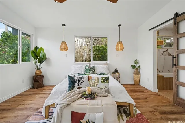a living room with furniture window and wooden floor