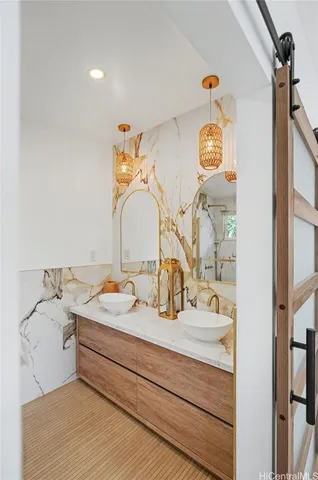 a bathroom with a sink and a mirror
