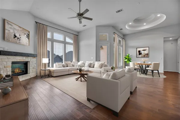 a living room with furniture and a fireplace