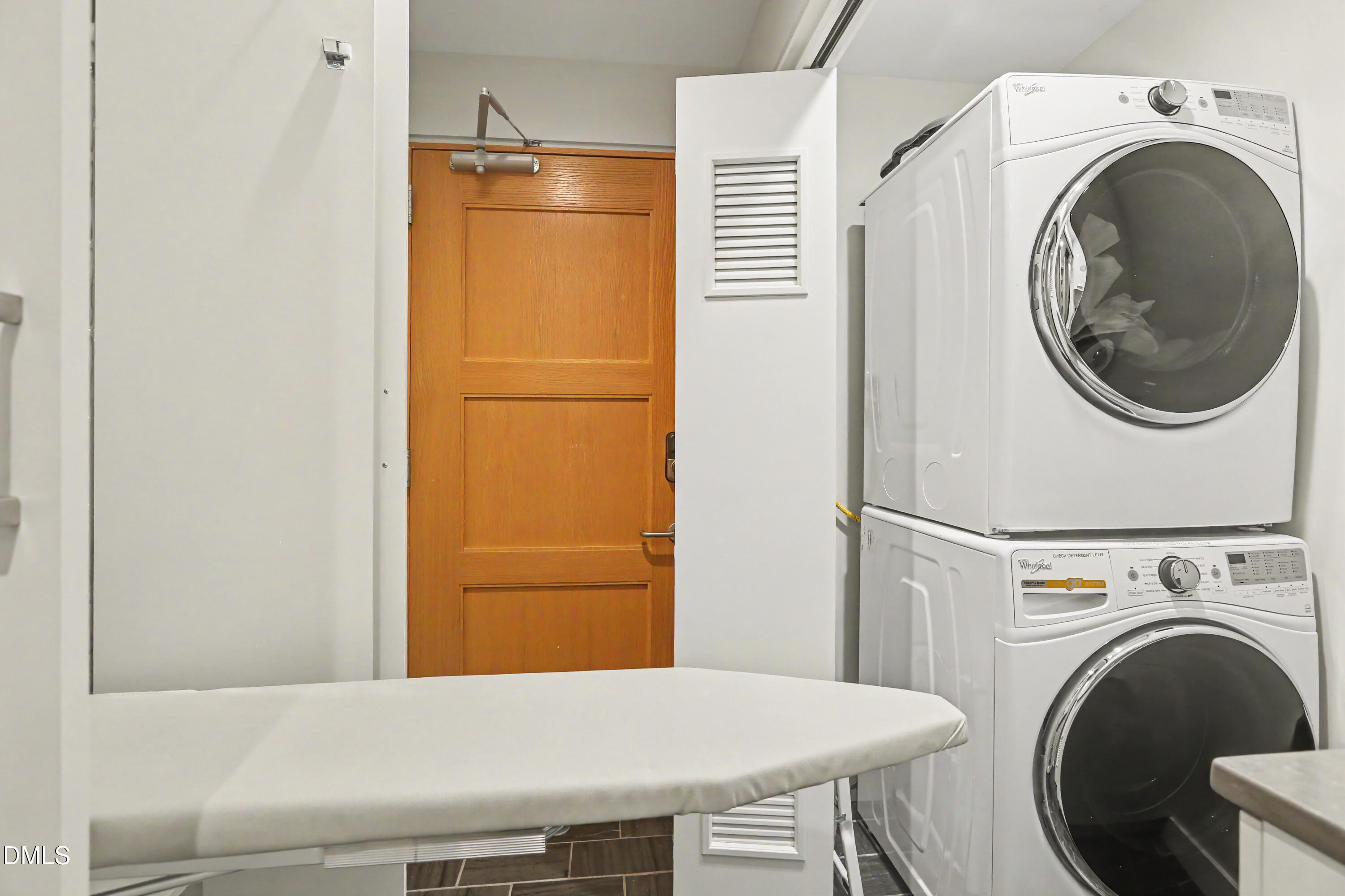 331 West Barbee Chapel Road Chapel Hill, NC 27517 - Photo 68 of 92 a view of a storage and utility room with washer and dryer