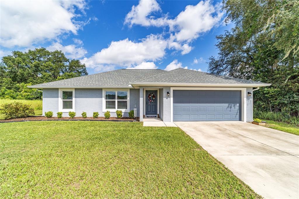 4 Willow Road Ocala, FL 34472 - Photo 1 of 1 front view of a house with a garden