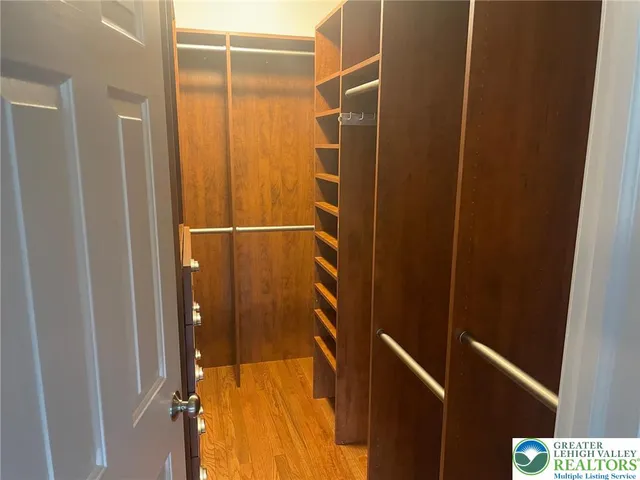 a bathroom with a shower and a glass door