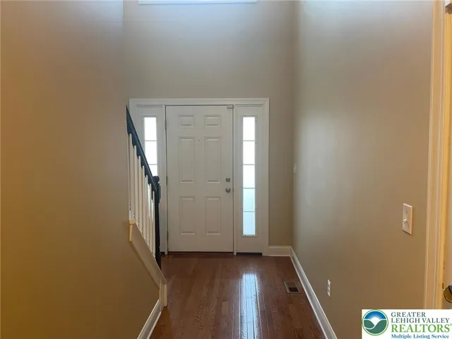 an empty room with wooden floor