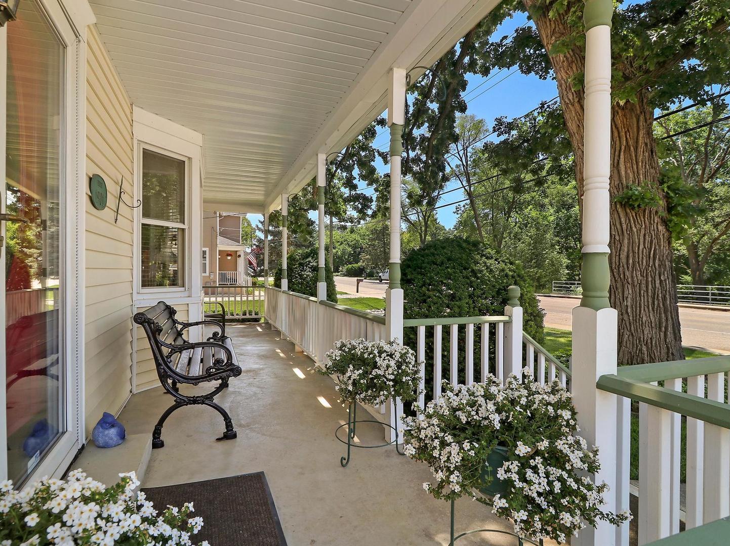 1918 Main Street Spring Grove, IL 60081 - Photo 4 of 27 a view of balcony with wooden floor and outdoor seating