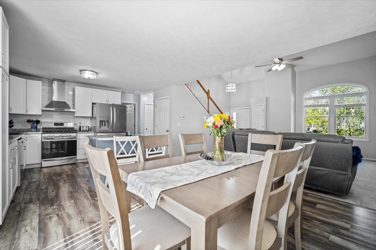 1509 Torrey Pines Road Normal, IL 61761 - Photo 11 of 36 a view of kitchen with kitchen island stainless steel appliances sink refrigerator dining table and chairs