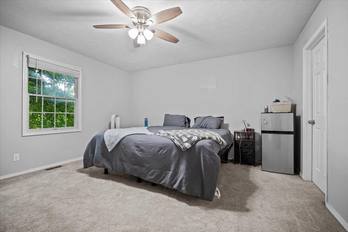 1509 Torrey Pines Road Normal, IL 61761 - Photo 21 of 36 a spacious bedroom with a bed and a window