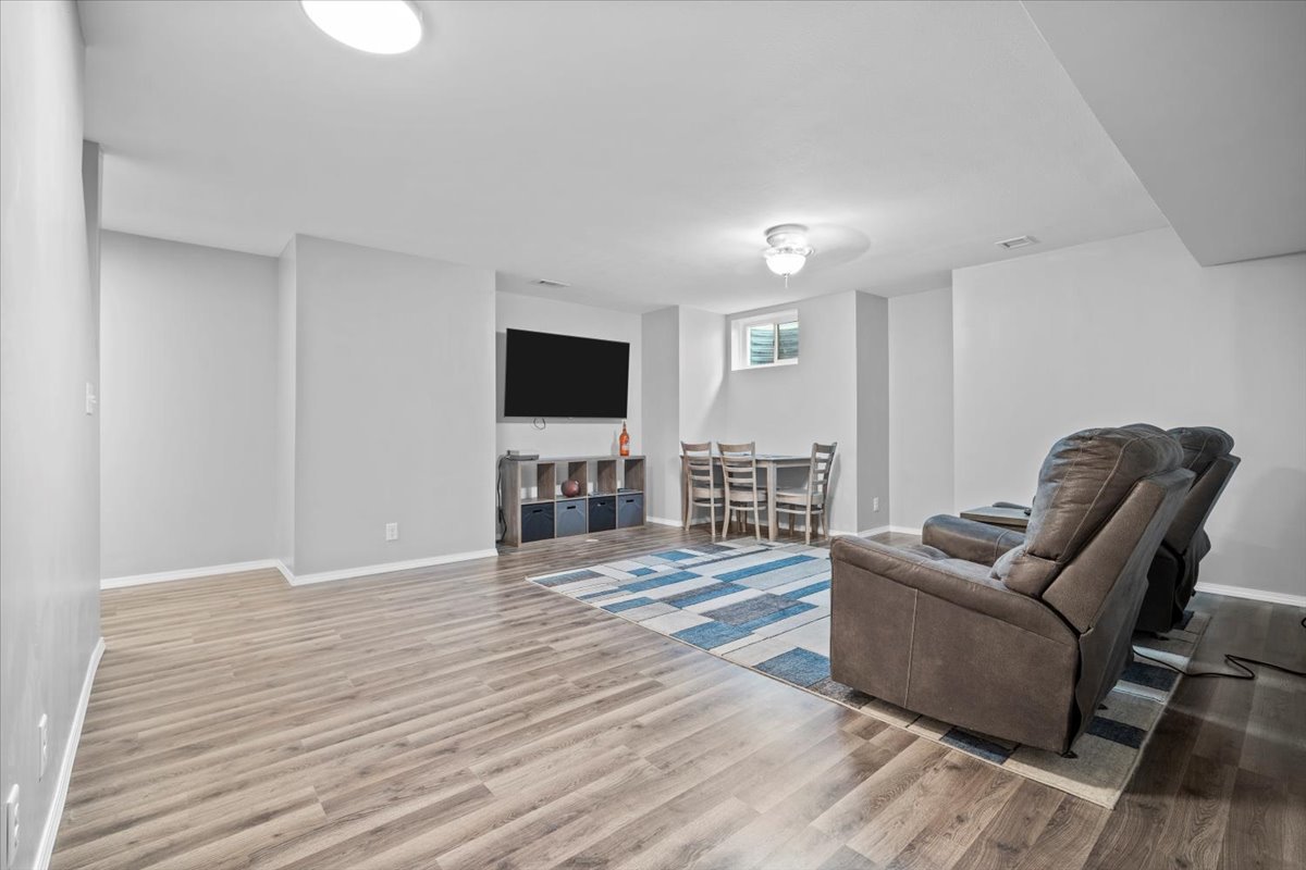 1509 Torrey Pines Road Normal, IL 61761 - Photo 24 of 36 a living room with furniture and a flat screen tv