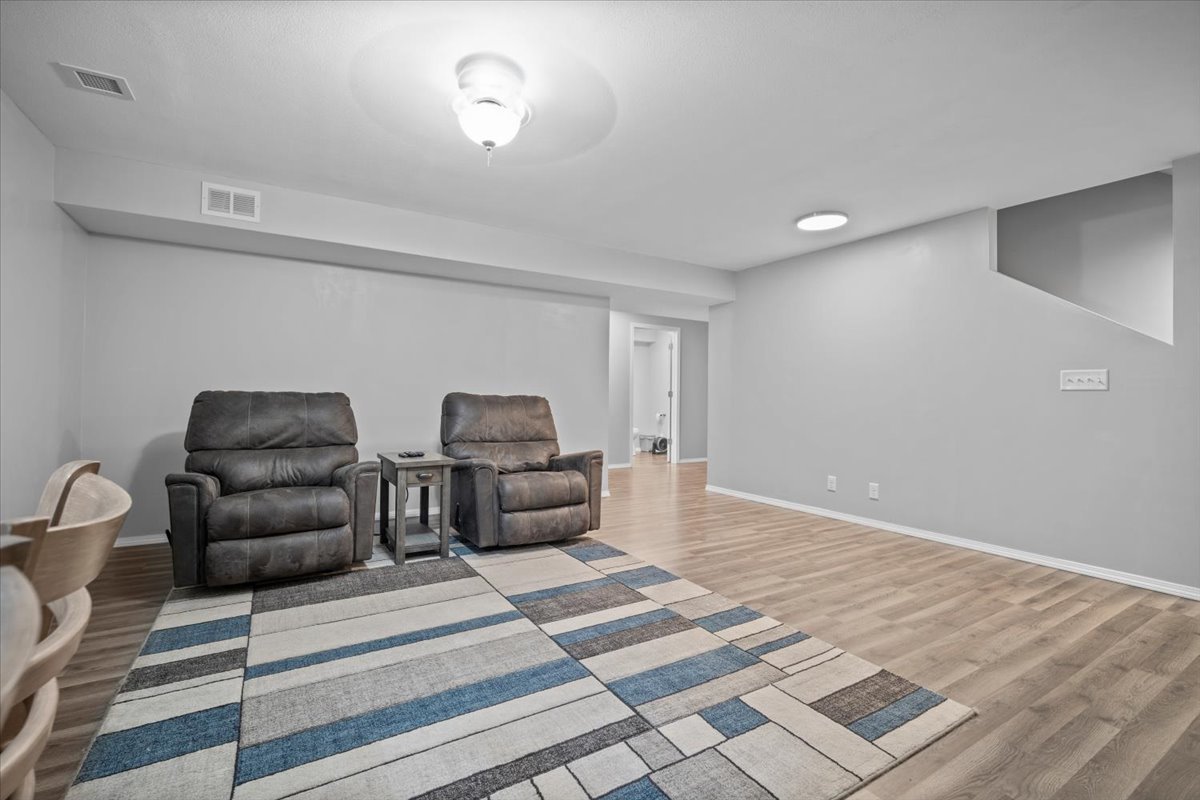 1509 Torrey Pines Road Normal, IL 61761 - Photo 26 of 36 a living room with furniture and a rug