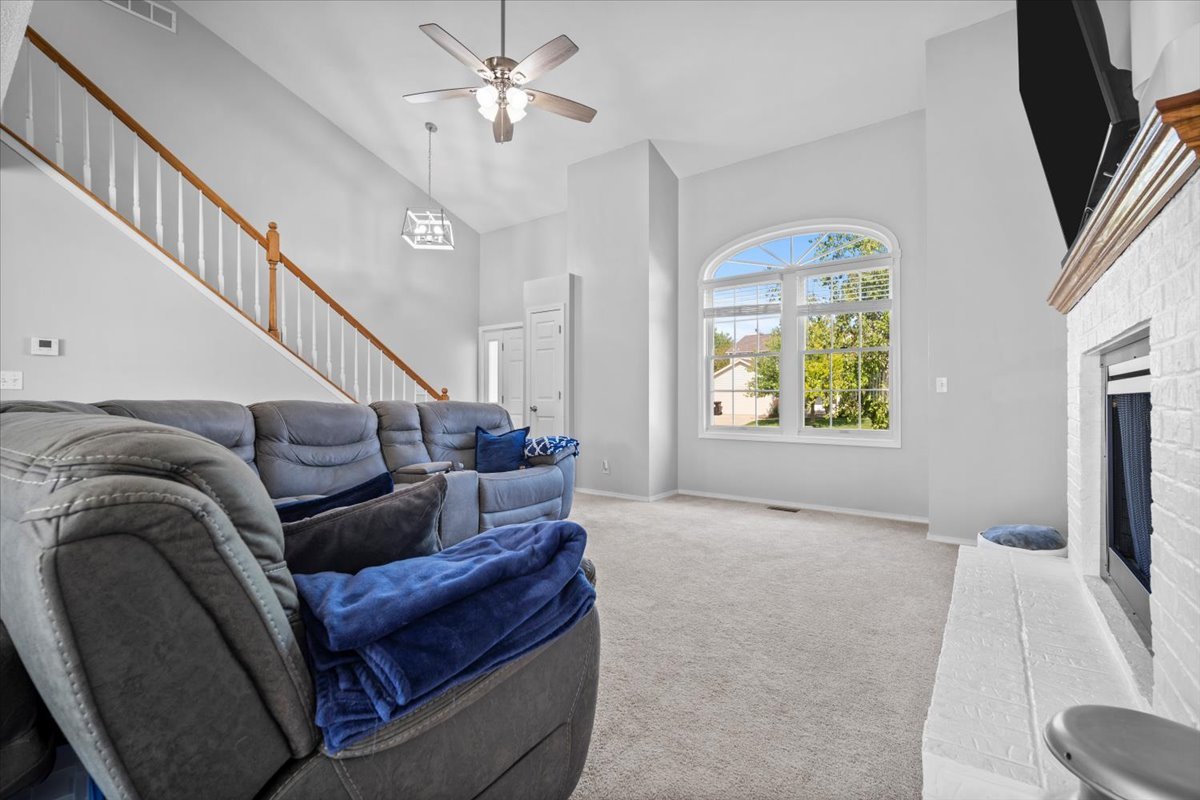 1509 Torrey Pines Road Normal, IL 61761 - Photo 6 of 36 a living room with furniture and a flat screen tv
