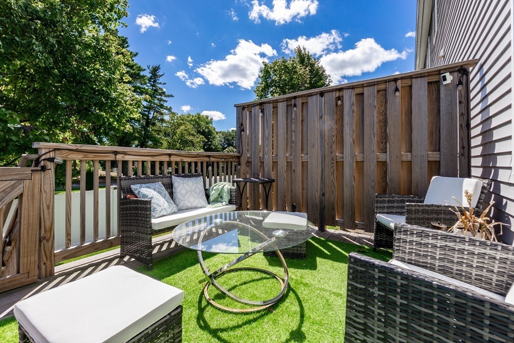55 Plymouth Street, Unit A5 Whitman, MA 02382 - Photo 32 of 34 a view of a chair and tables in the balcony