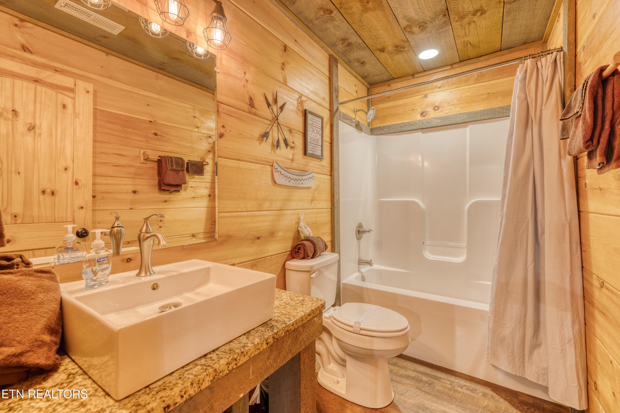 809 Pinecrest Way Sevierville, TN 37862 - Photo 41 of 60 a bathroom with a sink toilet a mirror and shower